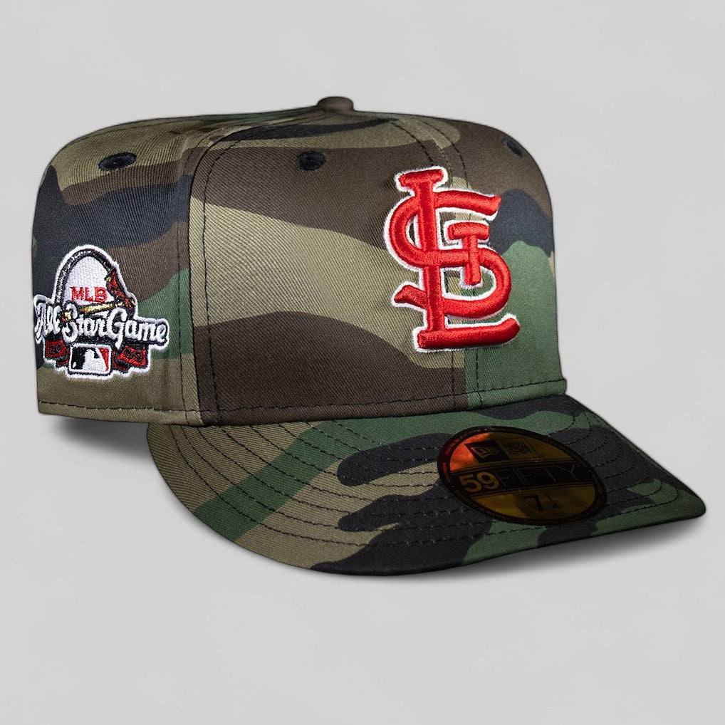 A St. Louis Cardinals baseball cap with an camouflage pattern and the team's logo in red on the front.